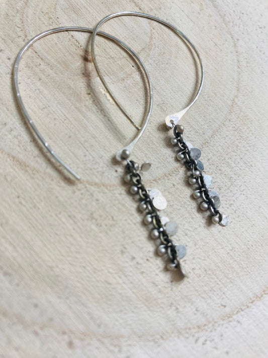 Hand forged sterling hoops with hammered silver paillettes